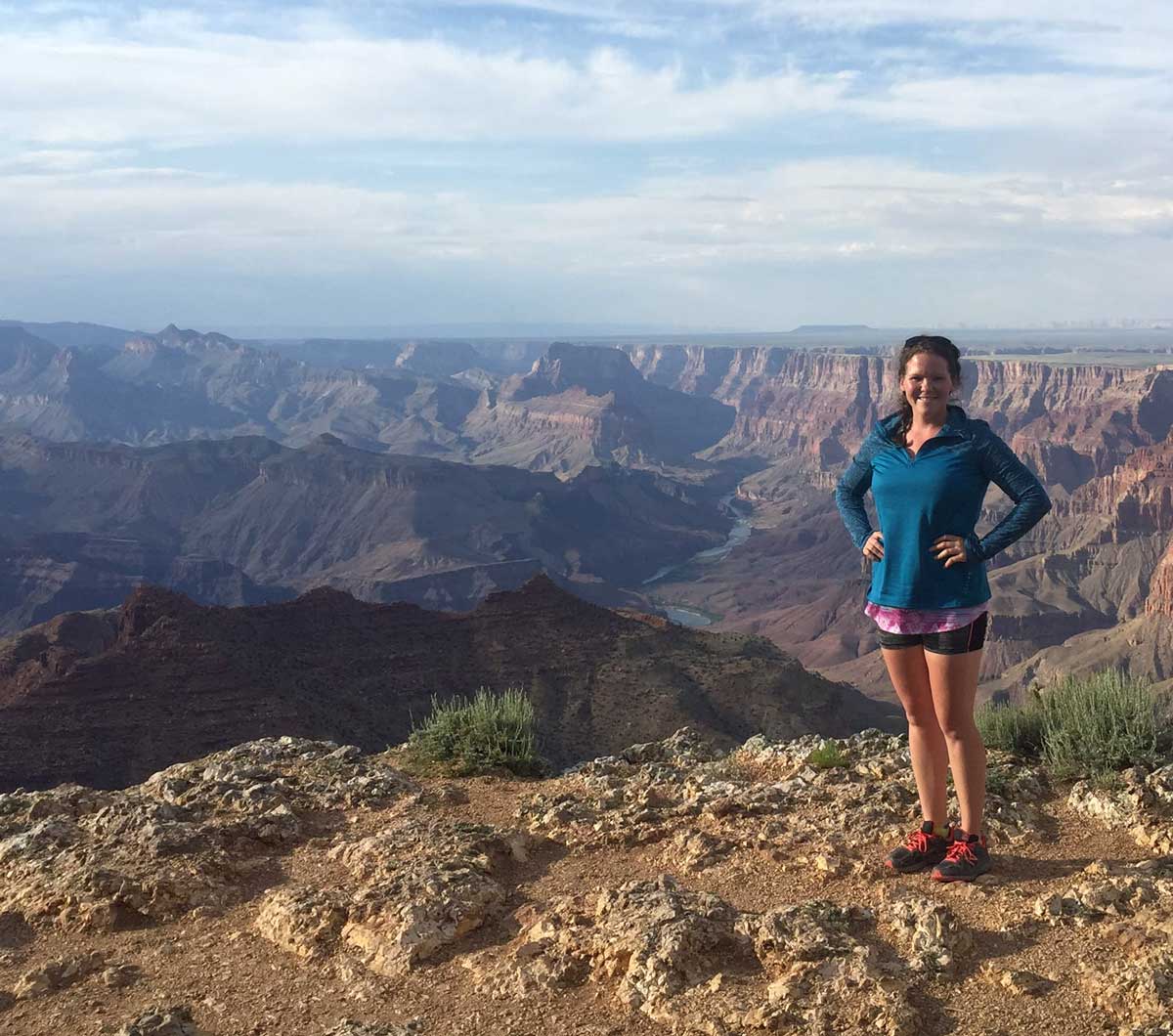 Holly, standing against the Grand Canyon, shares her transformative experience with the 21-day cleanse.