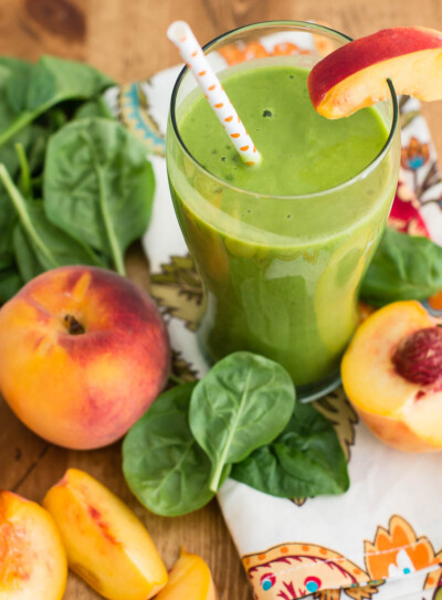 coconut milk smoothie with fresh fruit and leafy greens.