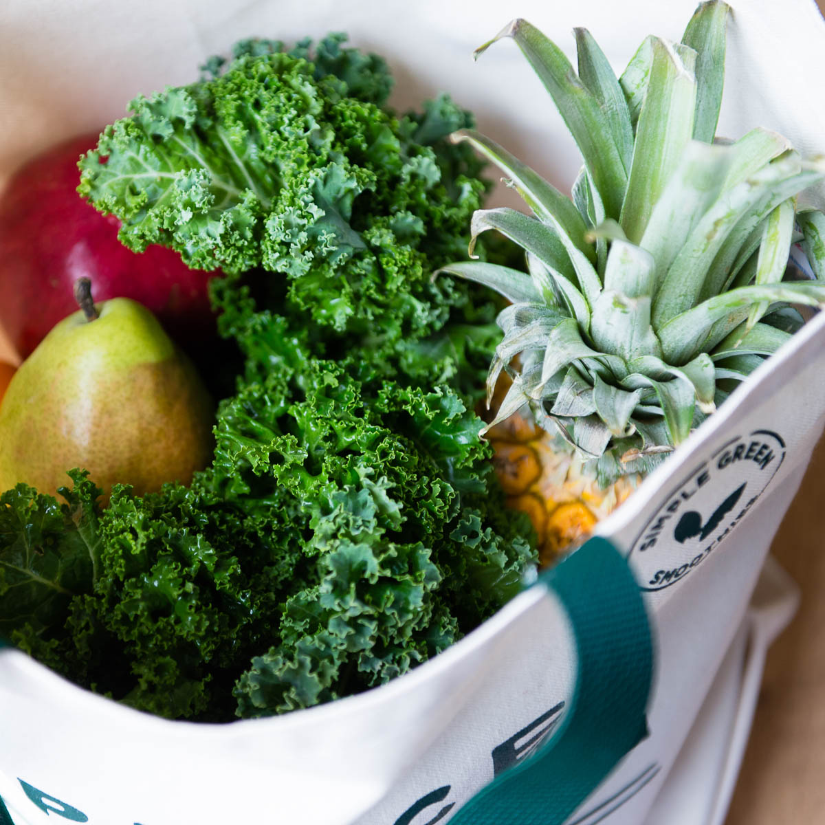 canvas tote full of produce oh the Dirty Dozen List or Clean 15 List from EWG.