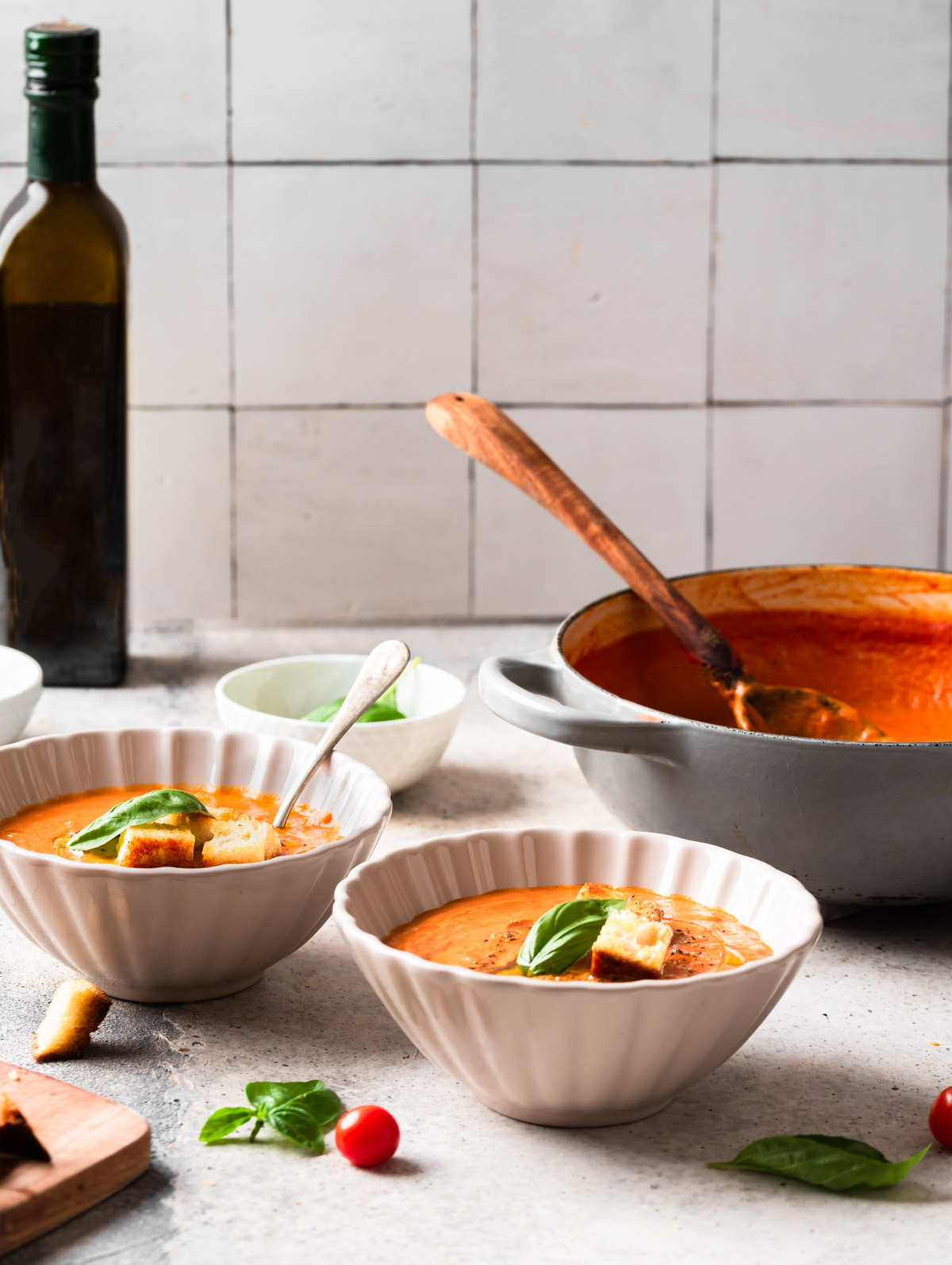 Fire-roasted tomato soup in a kitchen with bottle of olive oil