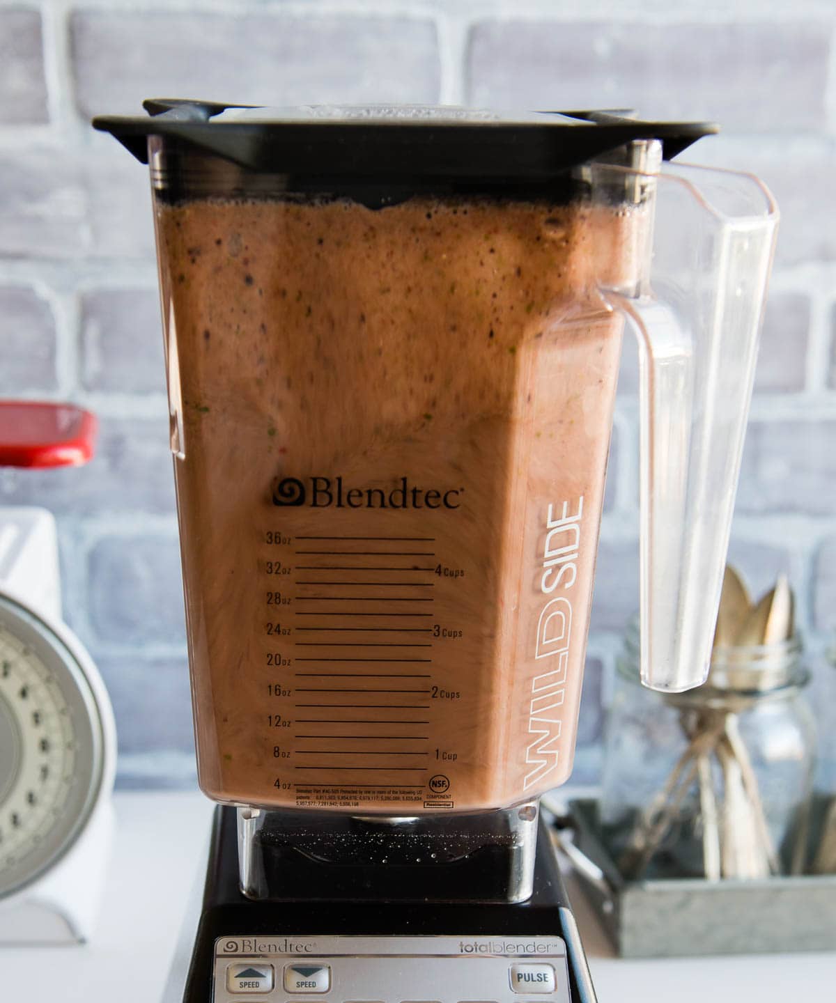 Blendtec blender in the middle of blending a smoothie bowl.