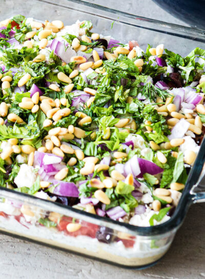 Close up photo of vegan Greek dip with fresh toppings