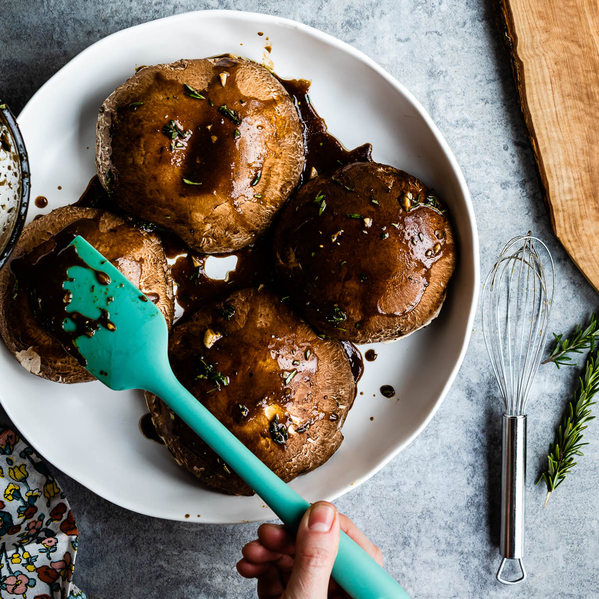 applying marinade to Portobello mushrooms