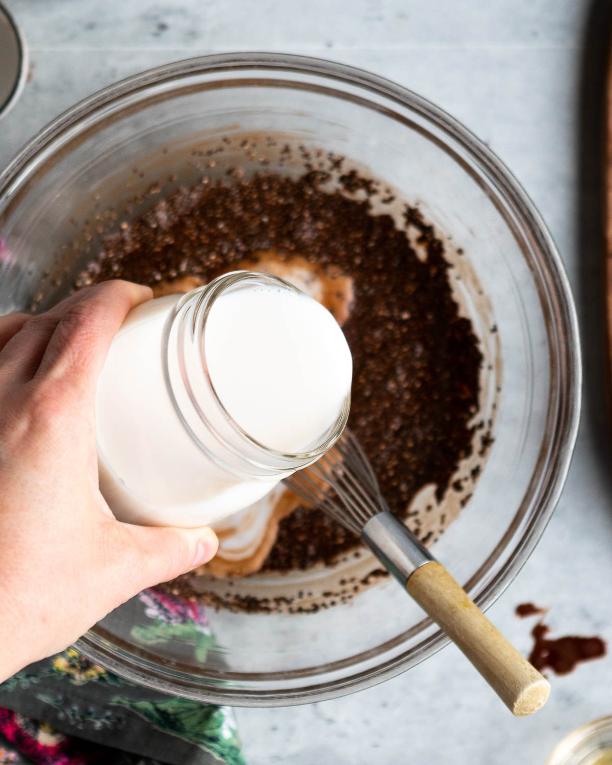 Adding coconut milk to chia seed pudding ingredients