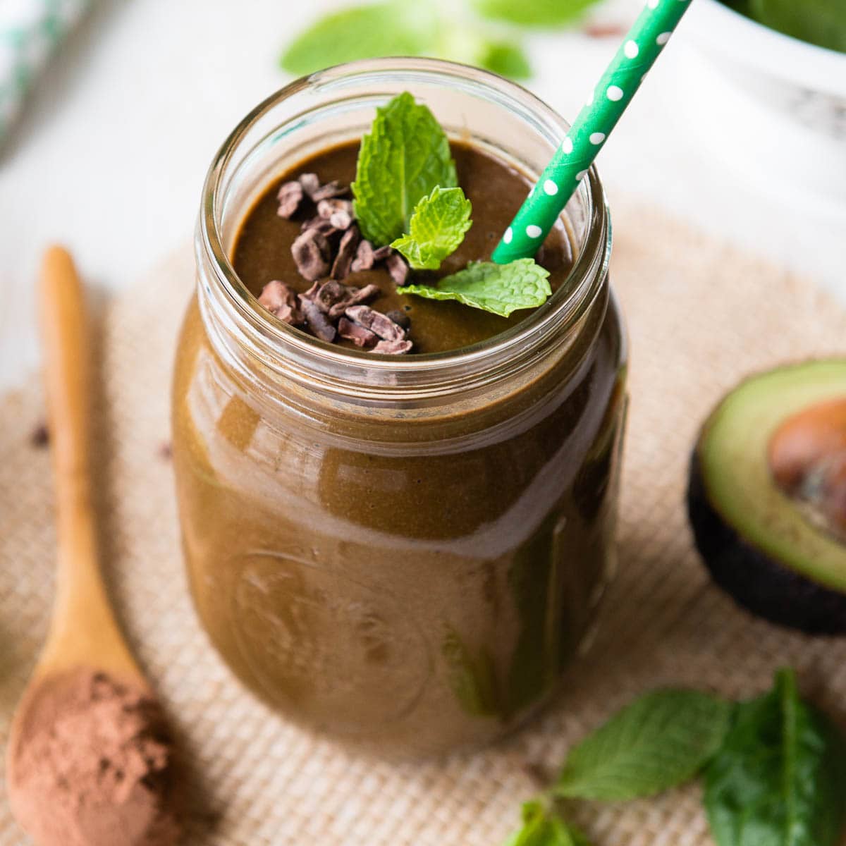 A mason jar filled with a skinny mint chocolate smoothie.