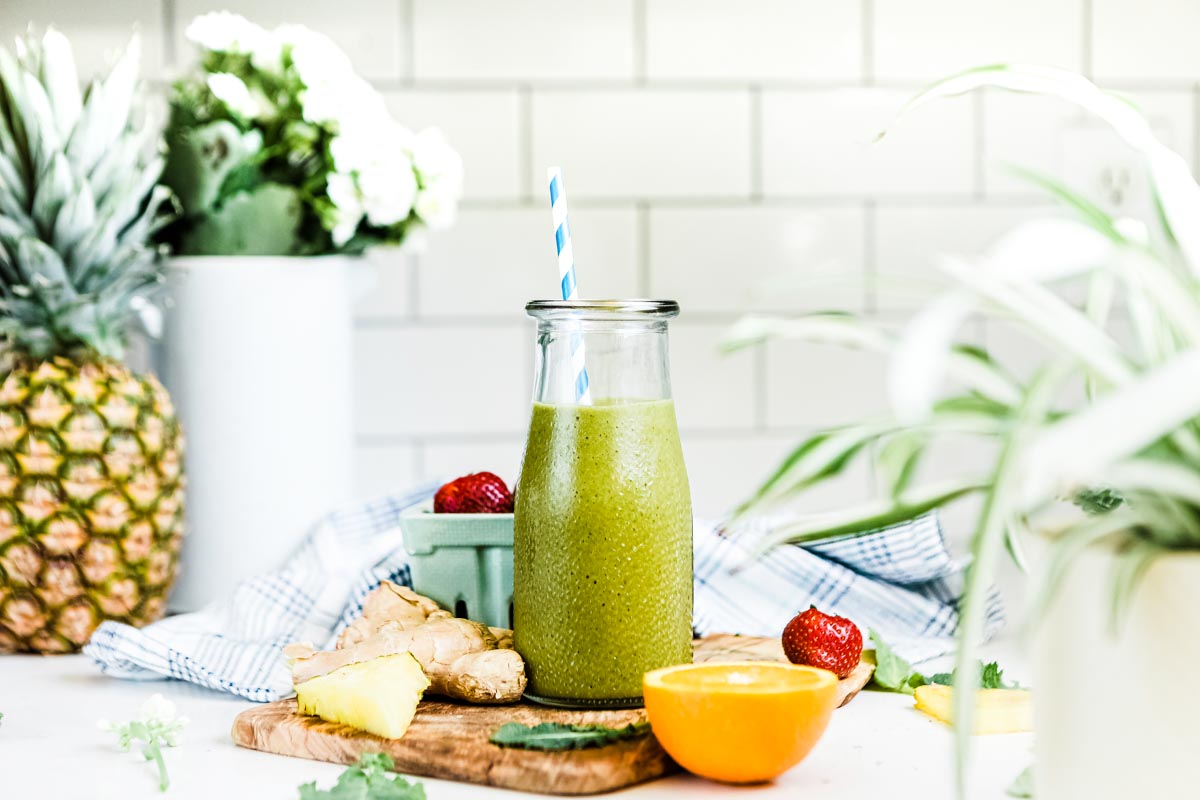 pineapple smoothie ingredients + finished smoothie in a glass jar.