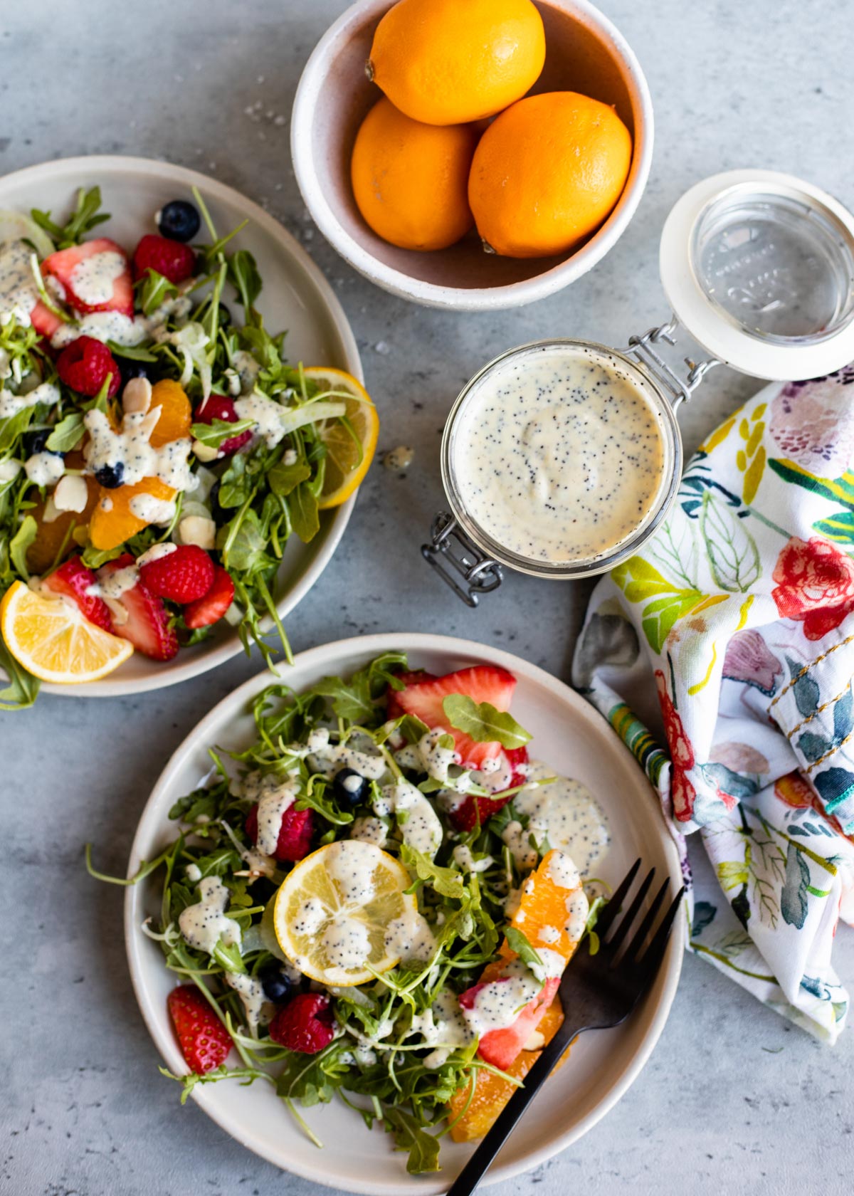 fresh, homemade dressing to top a homemade salad on a white plate.