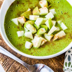 Healthy green smoothie bowl with toppings