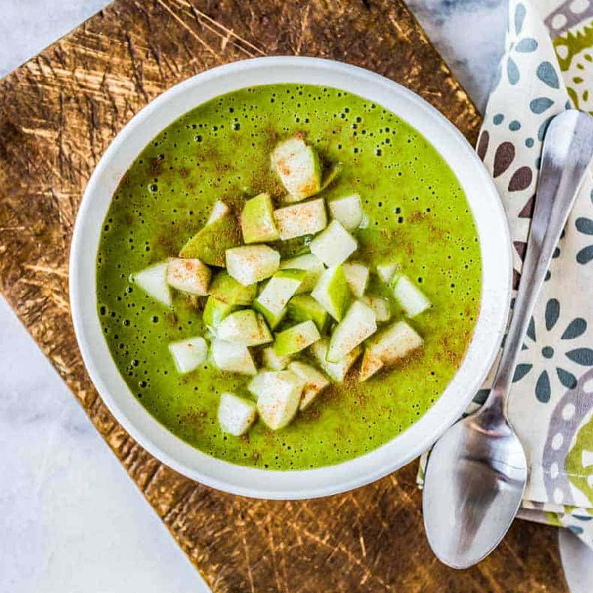 Healthy green smoothie bowl with toppings