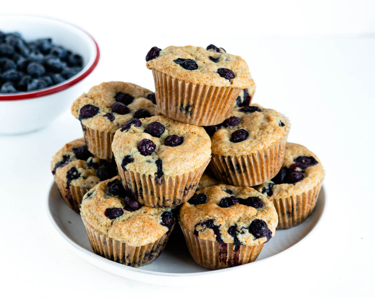 platter full of vegan lemon blueberry muffins on a plate.