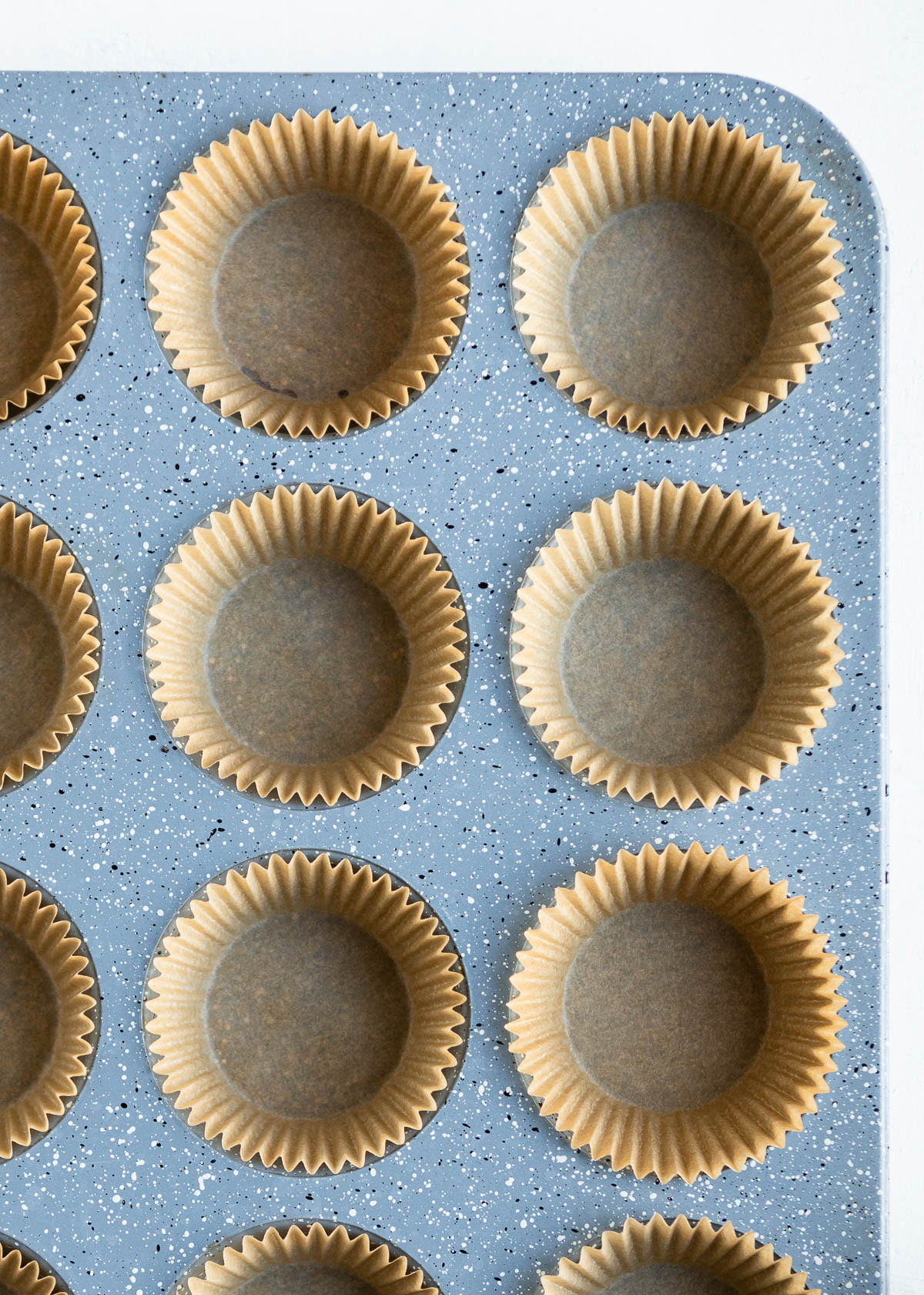 papers in a muffin tin.