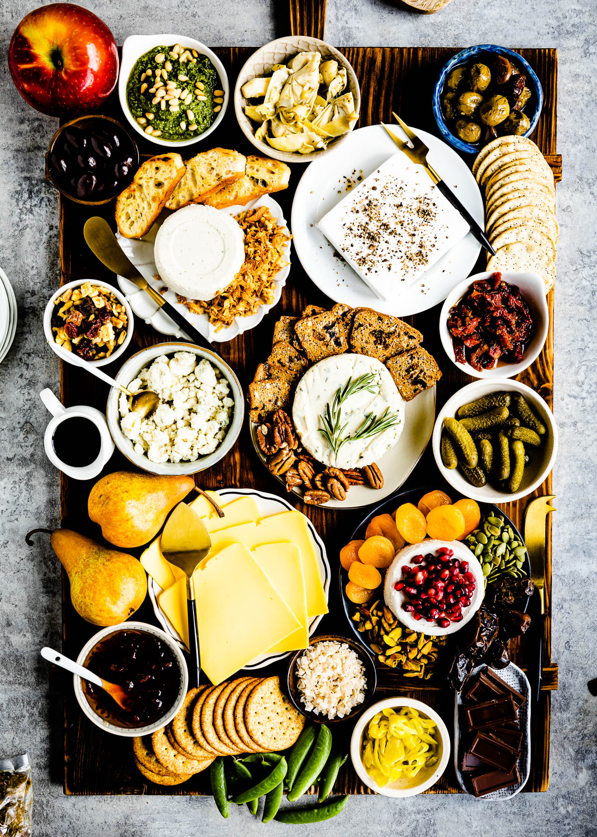 Charcuterie Board with various types of vegan cheese, Crackers, and veggies