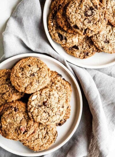 2 plates full of vegan chocolate chip cookies.