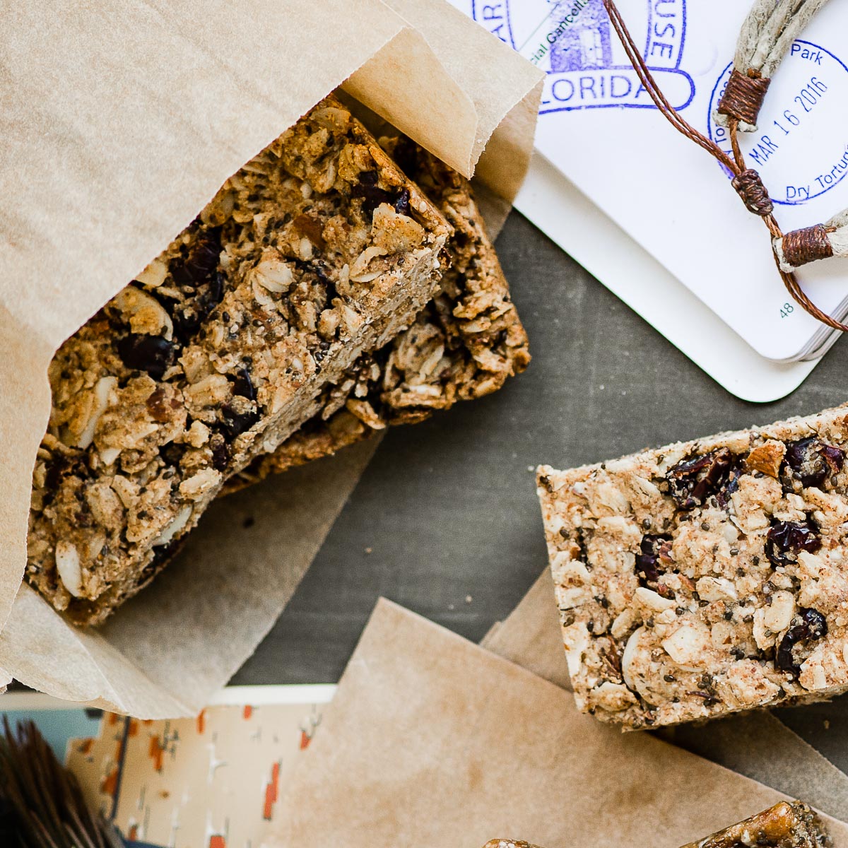 several vegan protein bars wrapped in parchment paper.